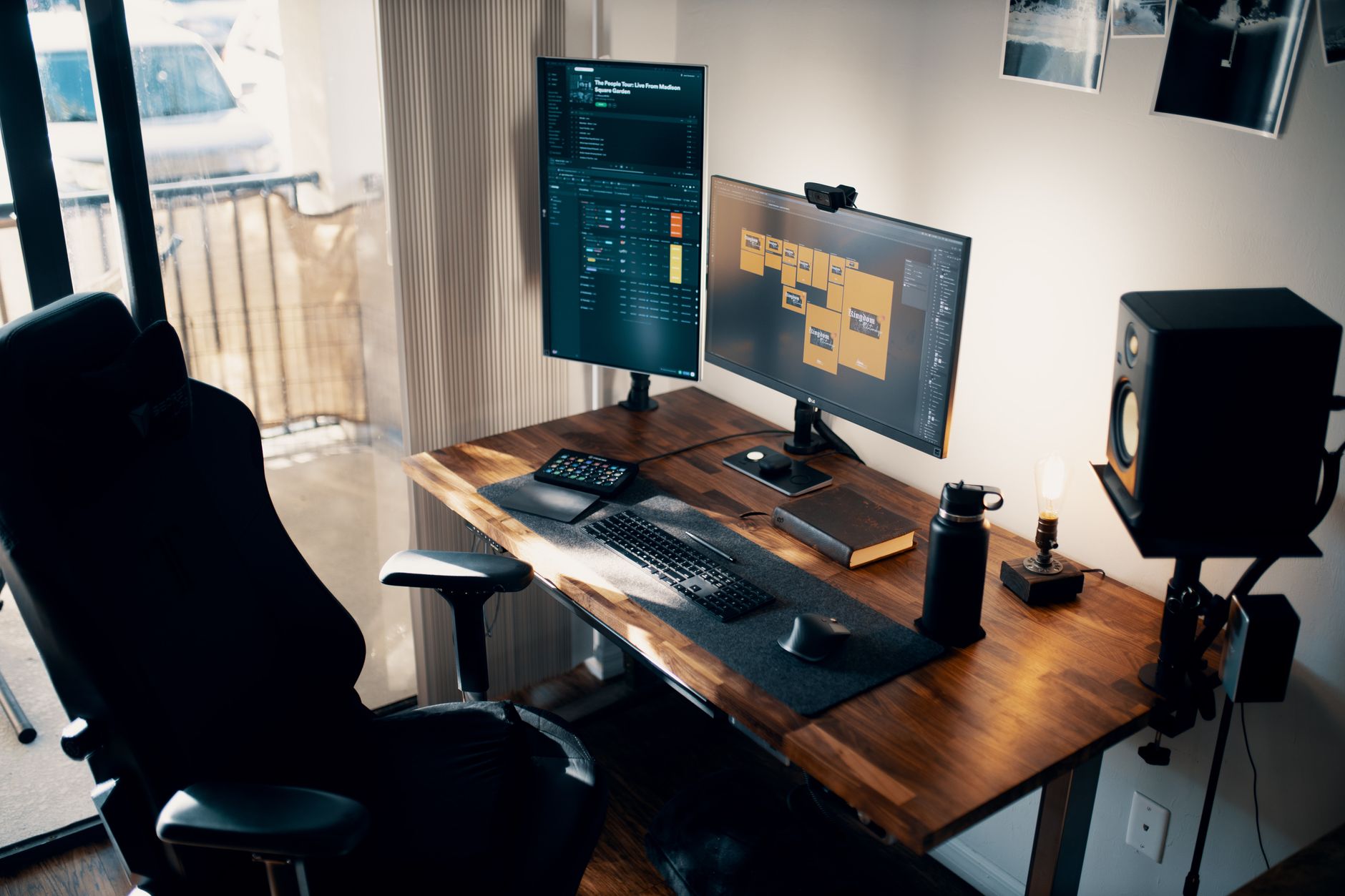 Logitech MX Brio webcam perched on a home office monitor